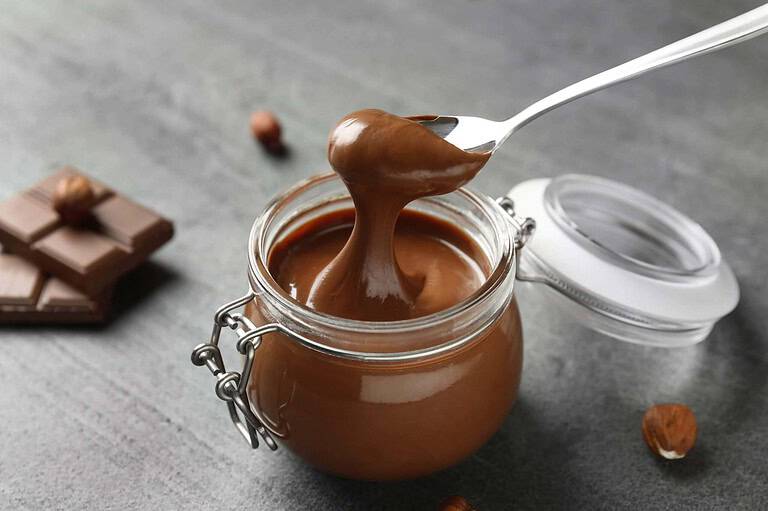 Taking Chocolate Spread from a huge jar